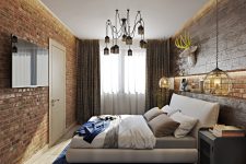 02 Though the bedroom is small, there are a lot of stylish touches like a brick wall or an industrial metal chandelier