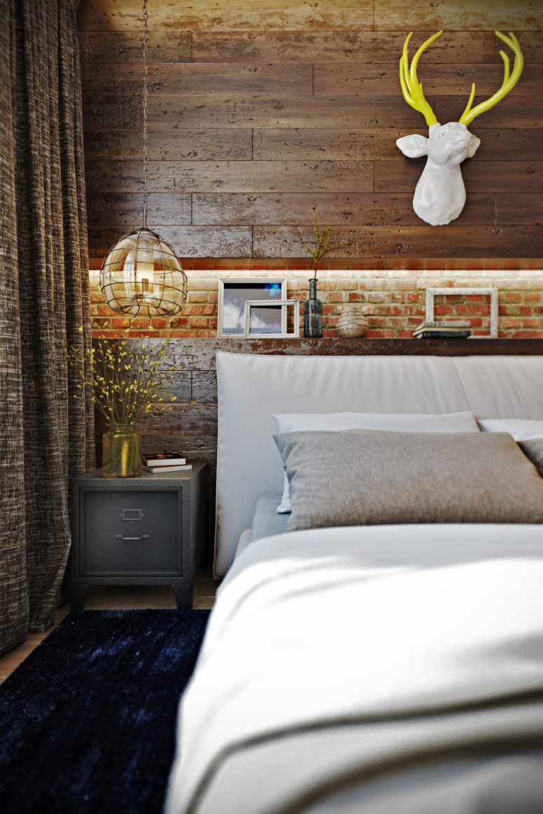 Rich amber and copper hues contrast with a neutral-colored bed and a blue rug