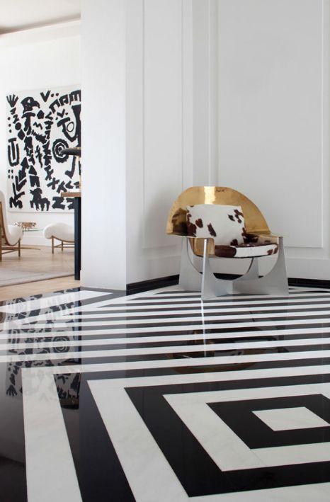 black and white stripe floor and dramatic metal chair