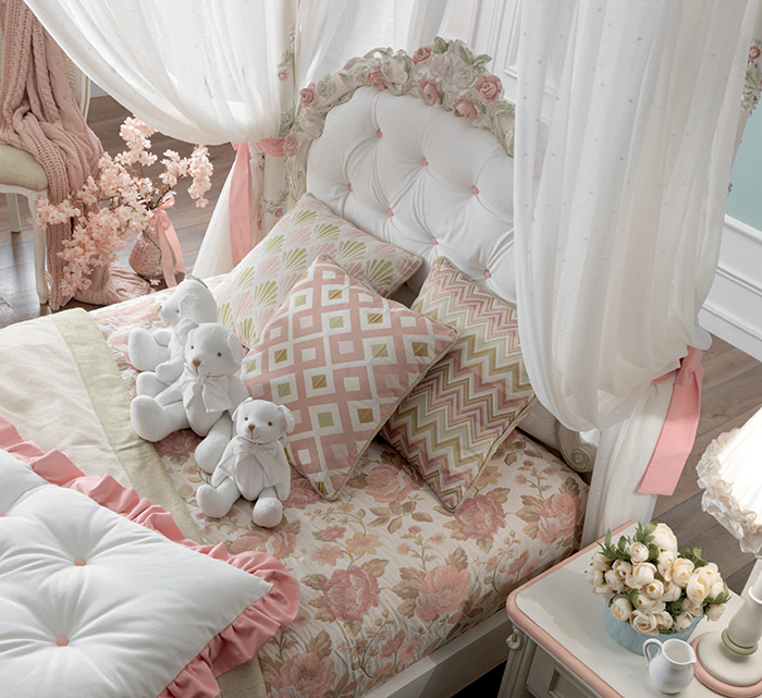 Luigina bed charms with a hand carved floral headboard and 4 canopy curtains to create privacy