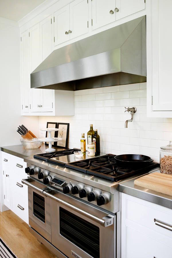 04 The kitchen is modern but subway tiles and wooden floros make it more traditional