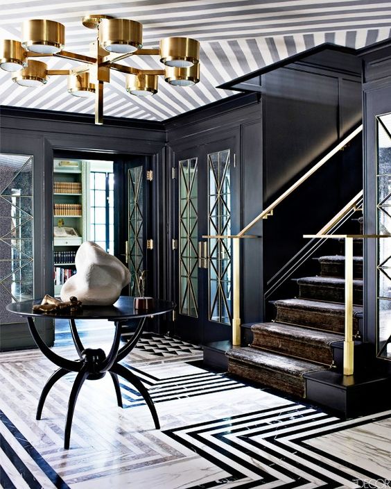 geometric marble graphic floors in a black and white patterned entryway