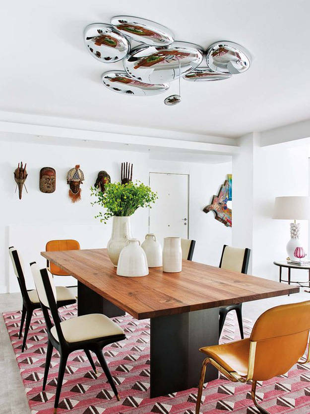 A large bubble chandelier marks the dining table