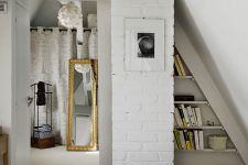 05 Elements of whitewashed brick clad give the bedroom a character