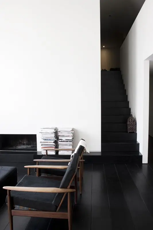 black wooden floors here are an important part of monochrome decor