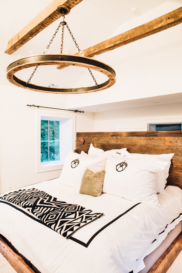 The master bedroom is decorated with reclaimed wood