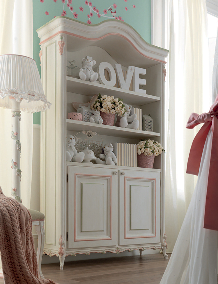 The Bookcase looks vintage and chic with its pink trim and hand carved edges