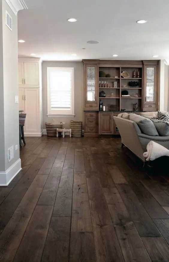 dark walnut floors in this living room have a noble weathered look