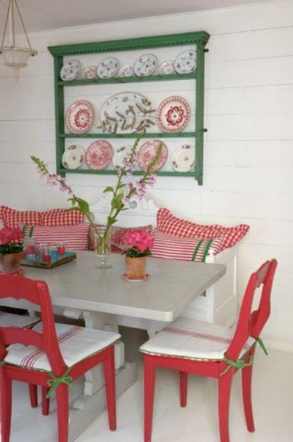 11 Glossy red and green dining area in a summer house