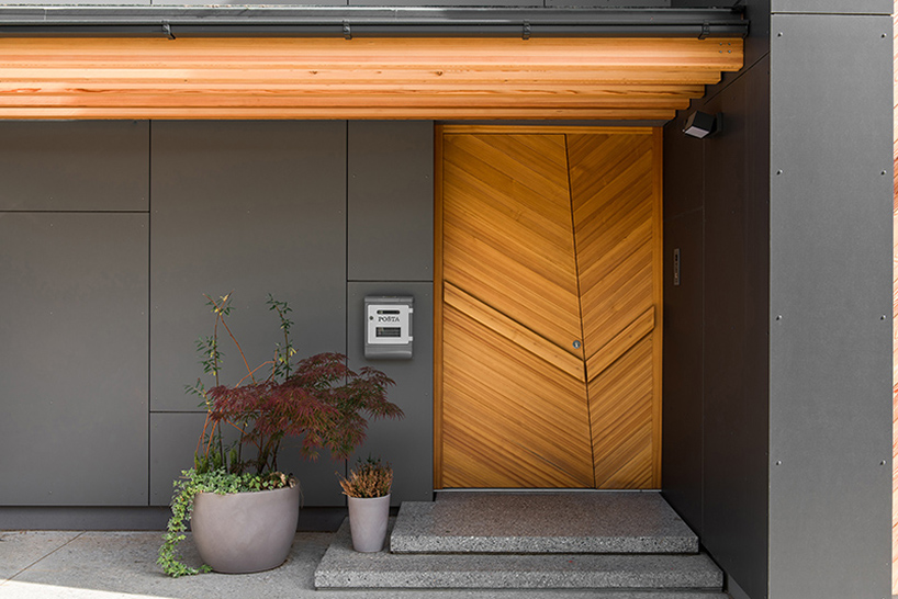 The entrance can boast a gorgeous modern wooden door in the same shade as screens