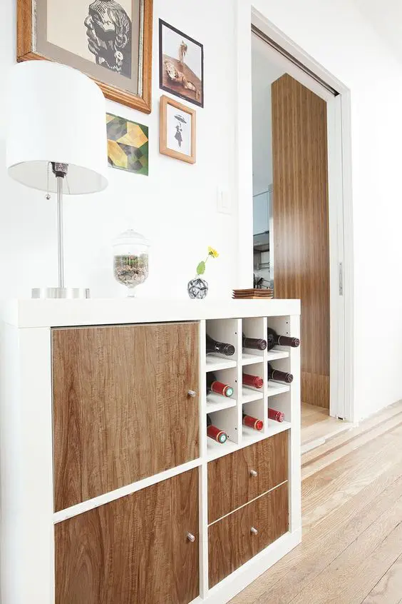 an IKEA Expedit home bar finished with drawers and doors and wine bottle compartments to make storage more effective and comfortable