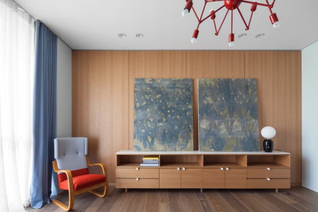 This is a mid century modern room with soothing art pieces