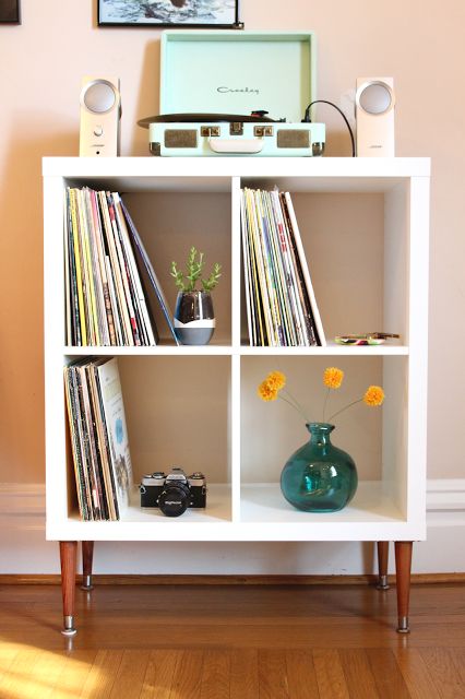 an IKEA Kallax piece as a vinyl record shelf, with tall legs and some decor is a cool solution if you need a media console