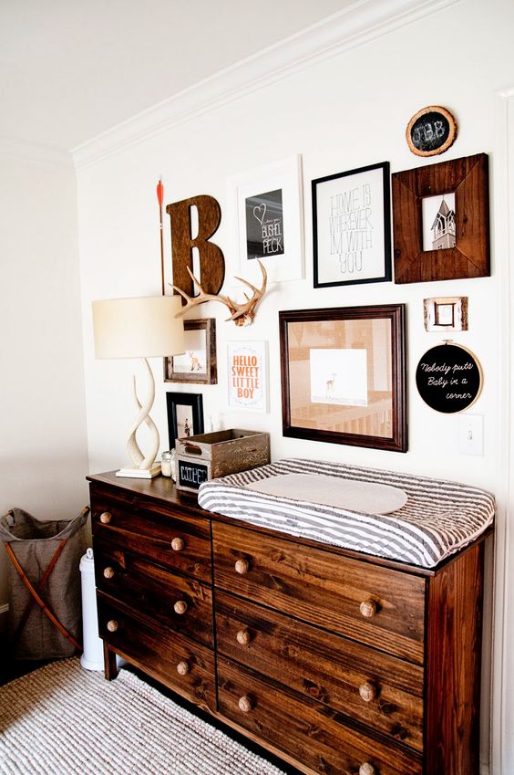 15 rustic nursery gallery wall and changing table with a lot of drawers