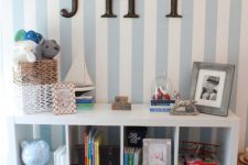 a Kallax shelf as a kids’ room storage piece, finish it off with matching basket drawers that will add a cozy rustic feel to the space