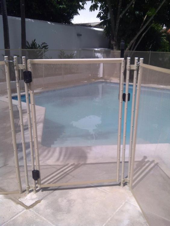 beige metal screen pool fence