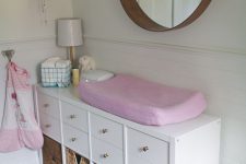 an IKEA Kallax turned into a comfy changing table with cubbies is a very smart and functional solution for any kids’ room