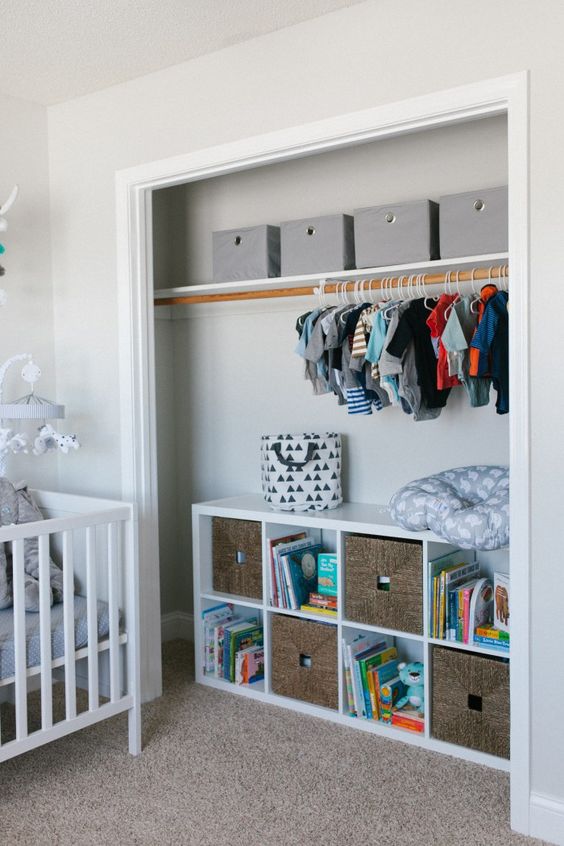 open closet with cubbies and drawers for toy storage