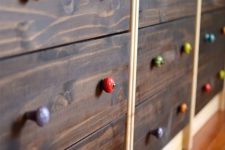 21 wood clad IKEA Rast dresser with colorful knobs