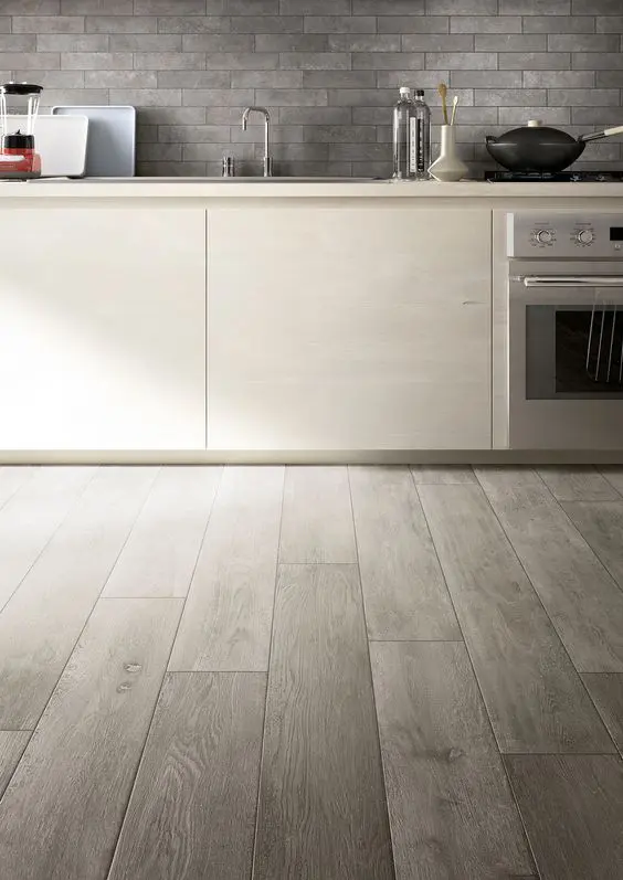 Ceramic wood printed grey tiles work great in every kitchen where floors may be scratched or spoilt