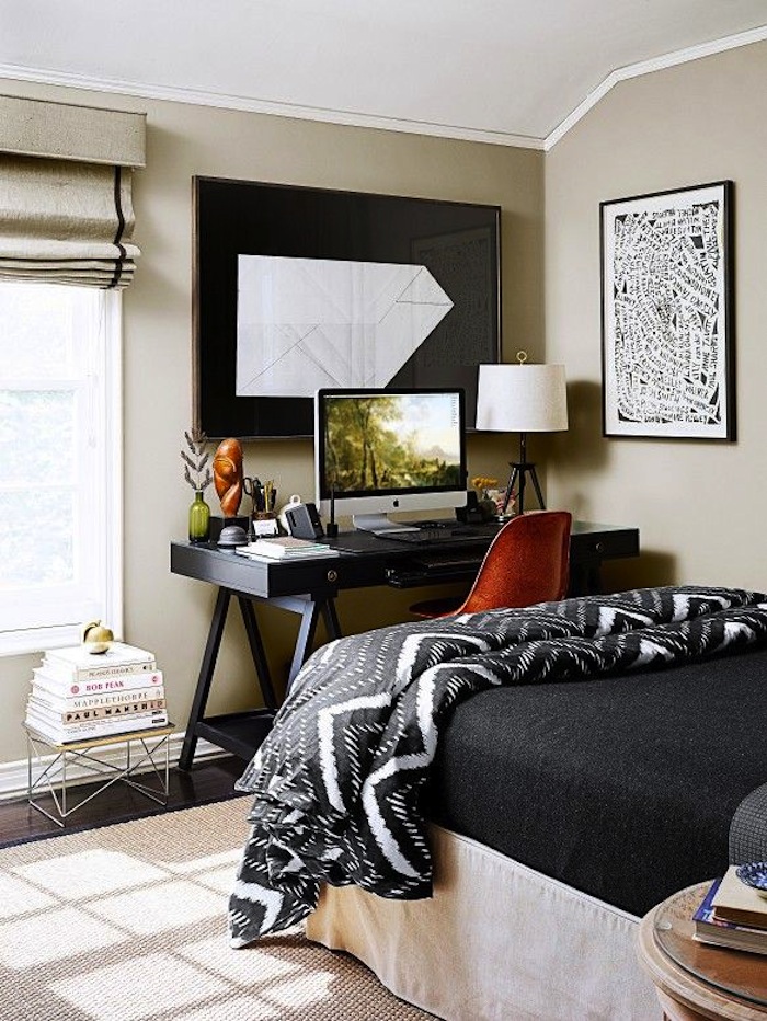modern interior with a black rustic desk and tan chair