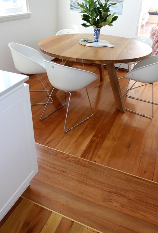 Wooden buffer zone between two spaces' floors