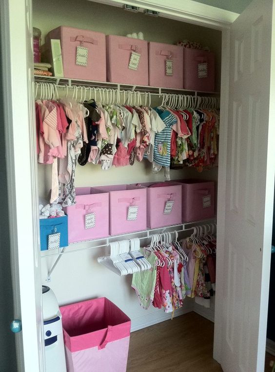 girl's closet with lots of boxes and cubbies