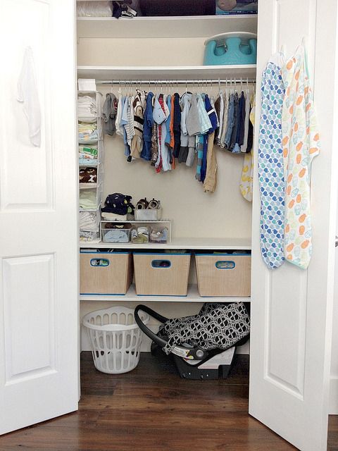 neat closet with hangers, cubbies and plastic shelving