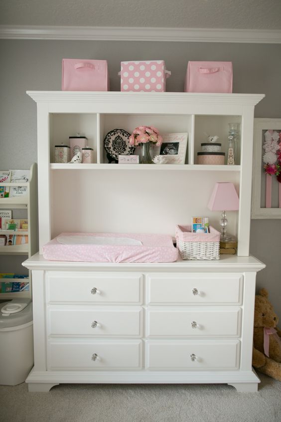 a dresser and hutch converted to a organized changing table