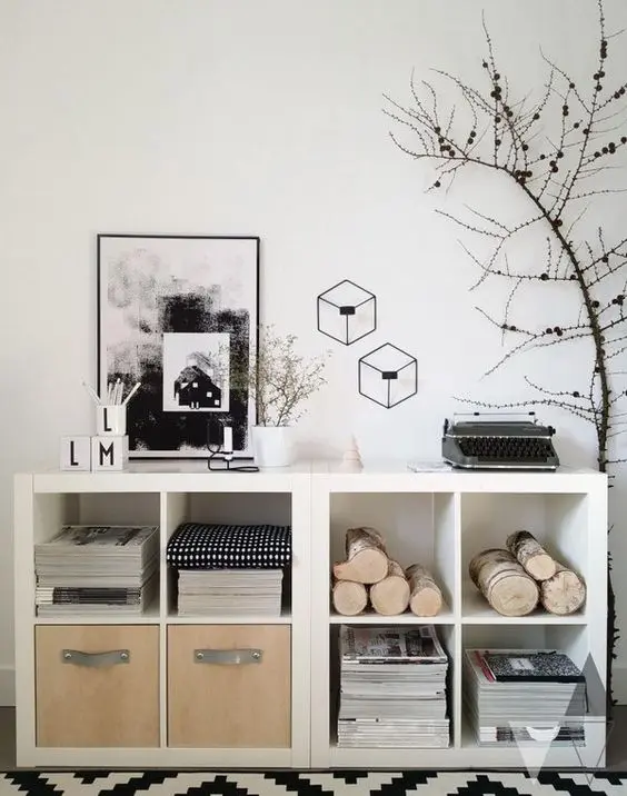 white Kallax shelving units turned into storage units with natural elements like plywood drawers is a lovely solution
