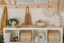 a boho chic storage unit made of an IKEA Kallax piece with storage baskets and a wooden countertop is a perfect idea for a boho space