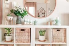 a couple of IKEA Kallax units with woven drawers and potted greenery is a cool solution for a boho or Scandinavian space