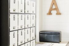 a large storage unit of a dark Kallax shelf finished with doors that turn it into lockers, with numbers and handles
