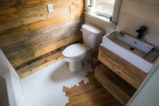 a stylish powder room with lots of reclaimed wood