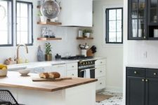a modern white kitchen with neutral and butcherblock countertops, a tiled floor and laminate, stained shelves