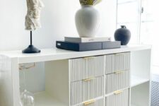 a refined home bar of an IKEA Kallax piece, with fluted drawers and elegant decor is a gorgeous idea for any modern home