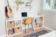 a storage desk composed of two IKEA Kallax pieces finished with woven drawers and some decor plus a yellow chairs is a cool idea for a kid’s room