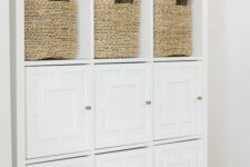 an IKEA Kallax piece with woven baskets and geometric doors is a pretty and cool dresser for a kids’ room