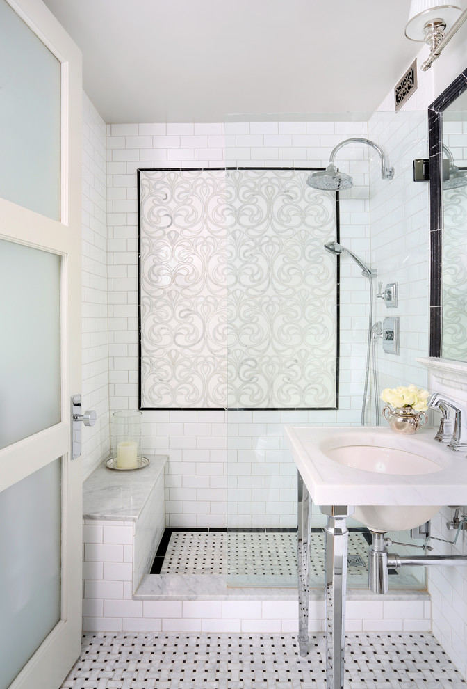 black border tiles are used as to create a tile wall art as to frame shower's flooring (Normandy Remodeling)