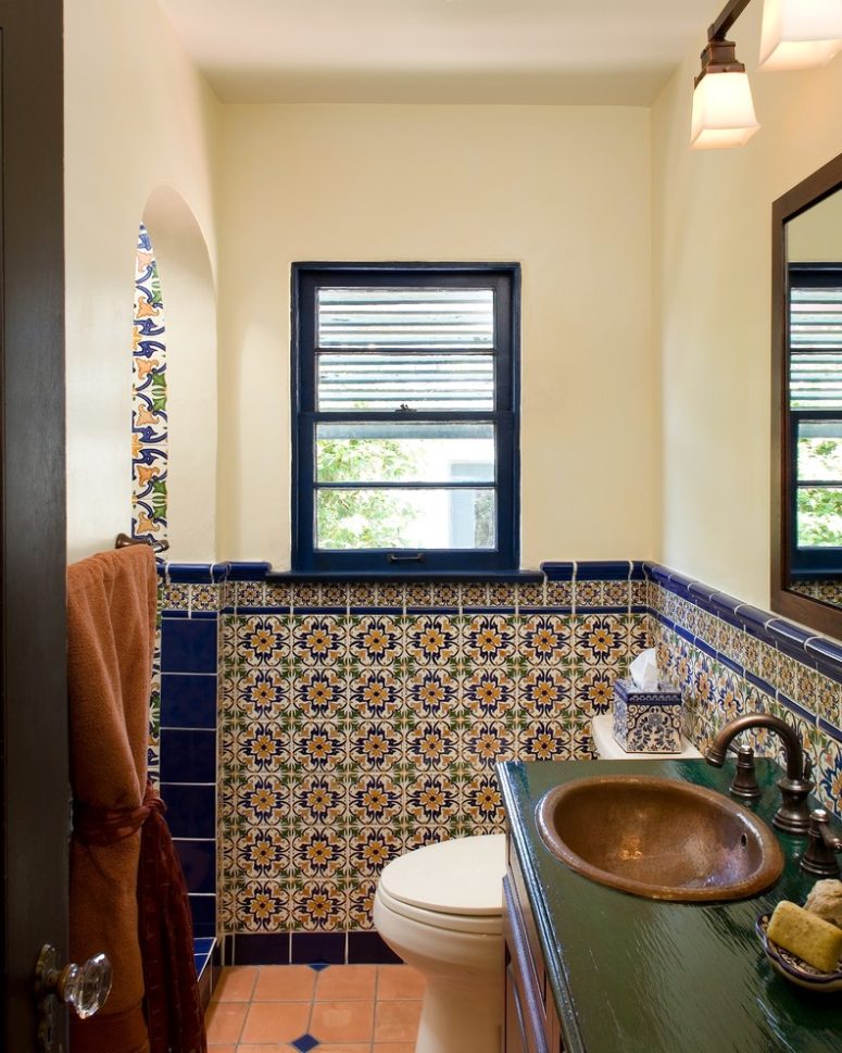 blue trim tiles separates spanish tiles from the painted parts of bathroom's walls (Avente Tile)