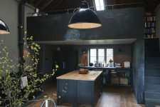 dark grey vintage-inspired kitchen with a large kitchen island