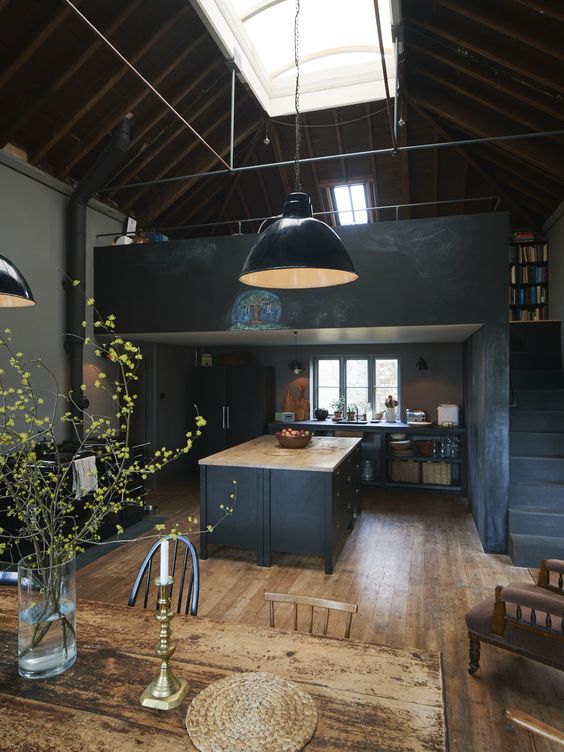 dark grey vintage-inspired kitchen with a large kitchen island