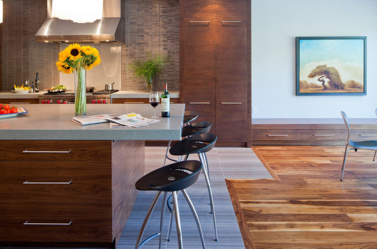 an irregular transition of natural wood flooring and kitchen floor tiles (Peter A. Sellar - Architectural Photographer)