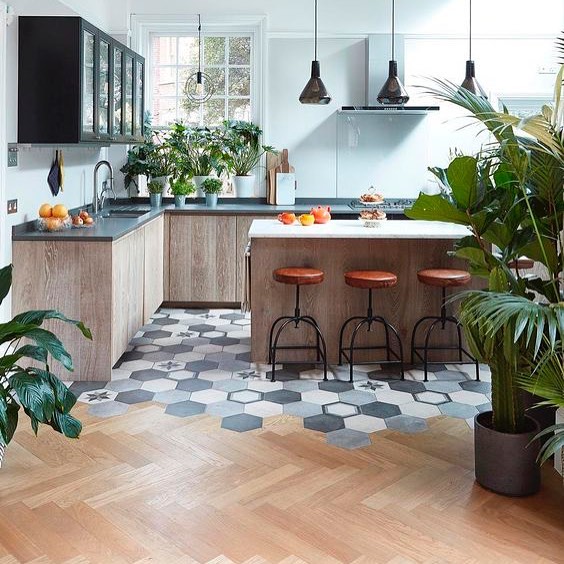 a cool wood and tile transition on a contemporary kitchen with retro elements (via @istoria_by_jordan_andrews)
