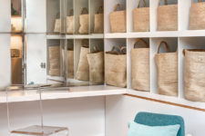 storage creative organized with IKEA Kallax shelves and star bags for a rustic feel, and an antique mirror and a jute rug add texture to the space