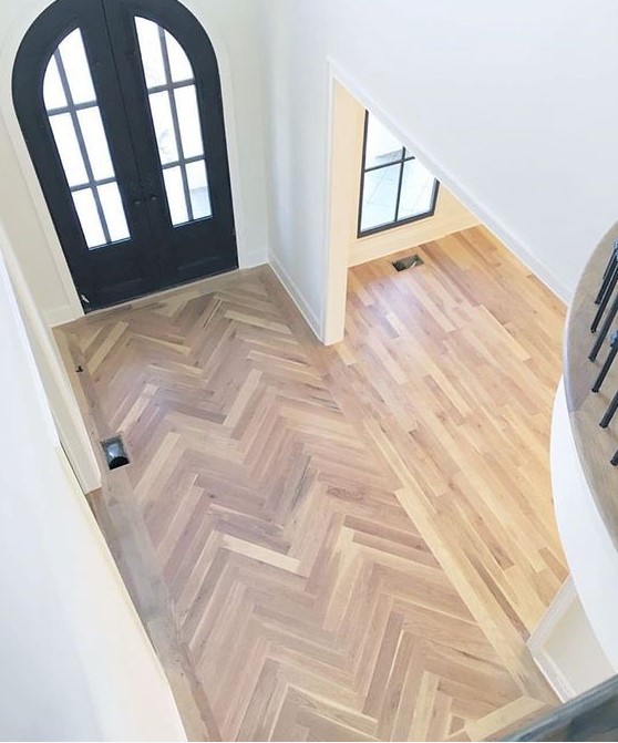 laminate clad in a chevron pattern and more regular laminate in the rest of the space with no gradual transition