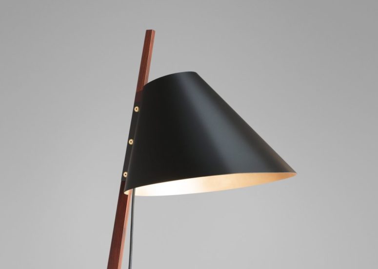 Billy BL floor lamp us supported by a slender rosewood stem and features a tapered matt black lampshade