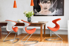 01 This dining setting is fun and the splash of orange really adds a lot to the room setting, corresponding hanging lights look awesome with Oyo chairs
