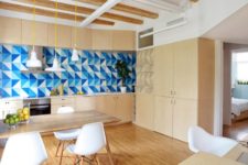 01 This modern apartment with light woods in decor and blue touches