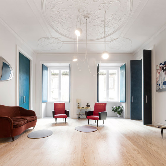Old plaster ceilings with all the structural elements were preserved to add a refined touch